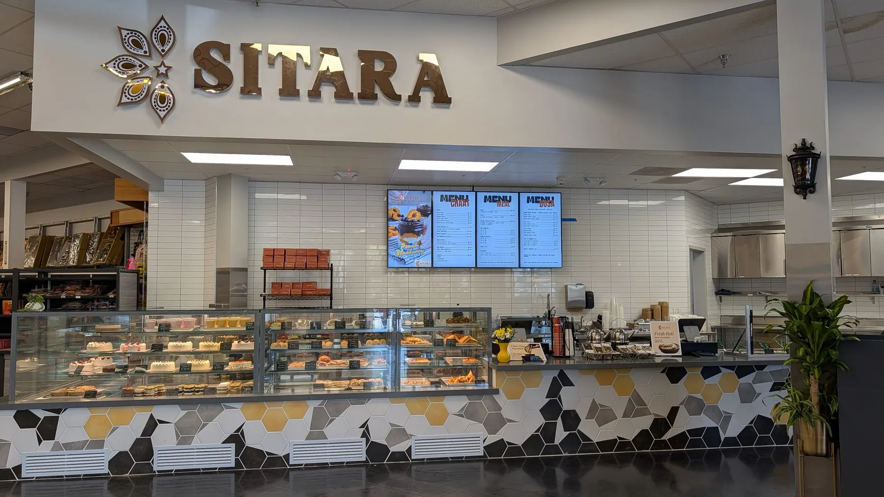 The Sitara counter beneath its brass sign