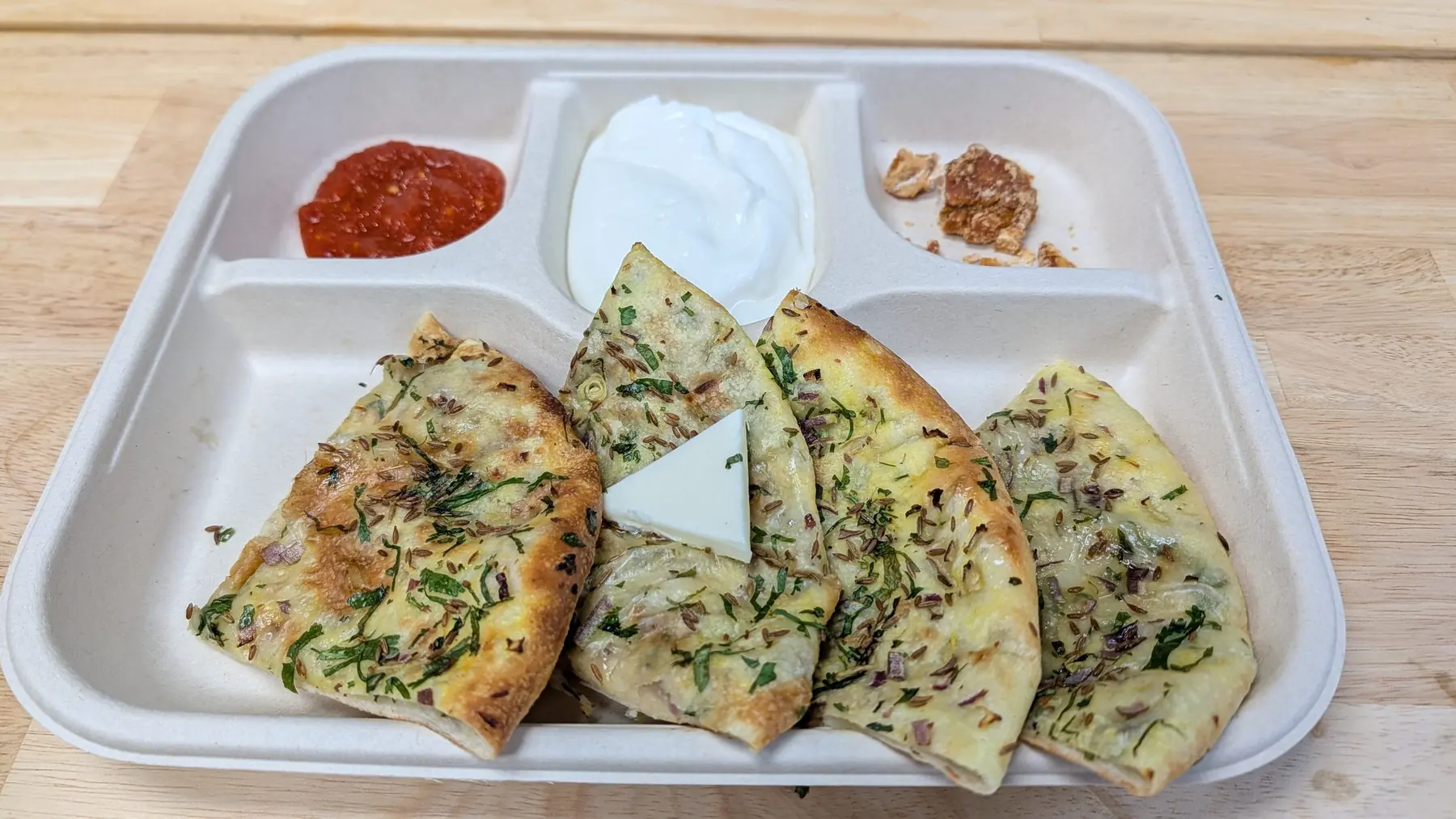 Kulcha with chutney, raita and pickle