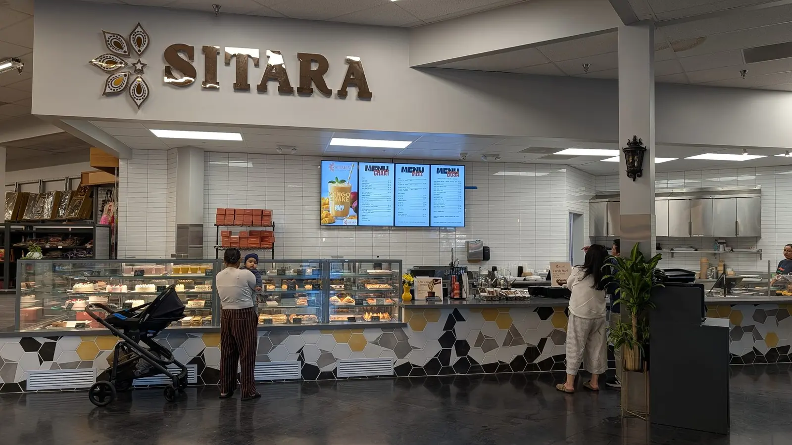 The Sitara counter under the brass sign